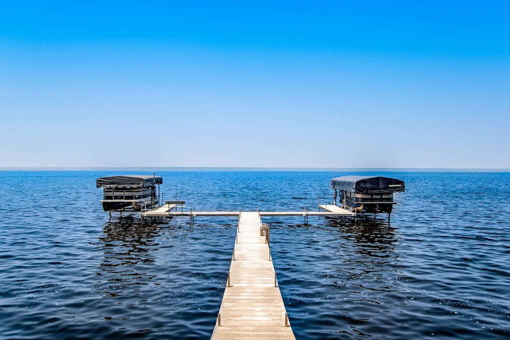 Secluded lake retreat with game room; near beach, boat rental, dining, and golf