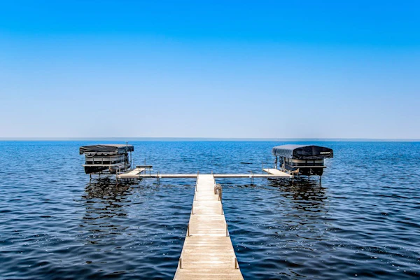 Secluded lake retreat with game room; near beach, boat rental, dining, and golf