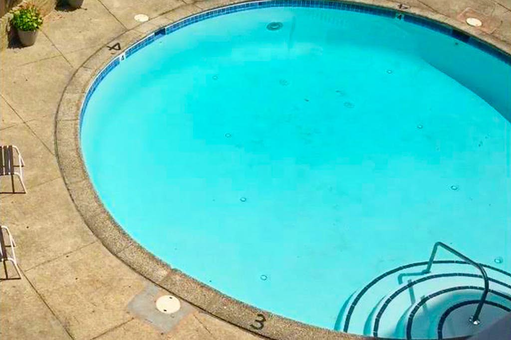 Ocean-view condo near the beach with outdoor pool & central AC
