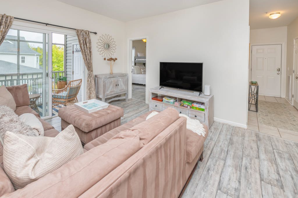 Villas at Bay Crossing dog-friendly condo with pool, balcony, water views, & W/D