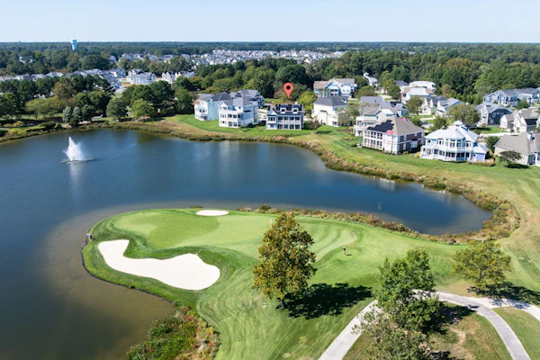 Elegant coastal retreat with golf course & pond views and bayside beach