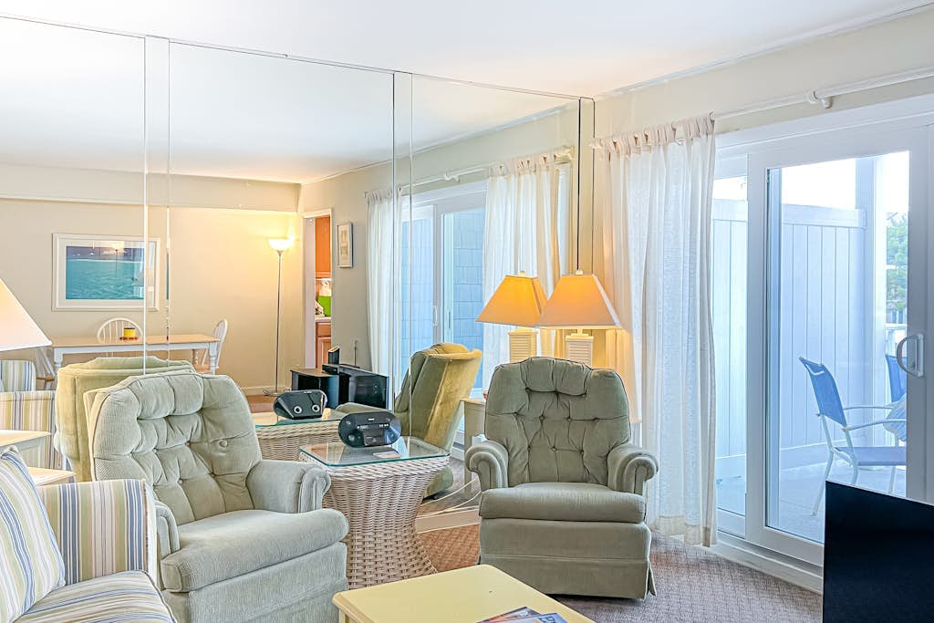 2nd-floor Sunspot condo steps from beach with balcony, outdoor shower, W/D, & AC