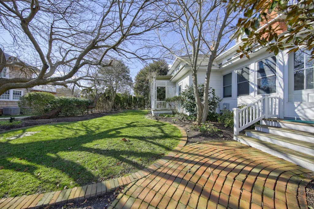 Classic 1920s oceanfront home & cottage with AC, bikes, grill - walk to beach