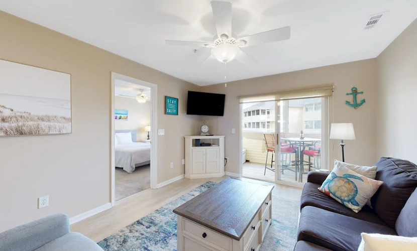 The Palms condo with a furnished balcony, pond view, washer/dryer, & pool