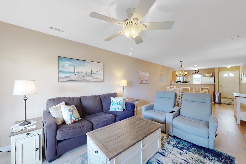The Palms condo with a furnished balcony, pond view, washer/dryer, & pool