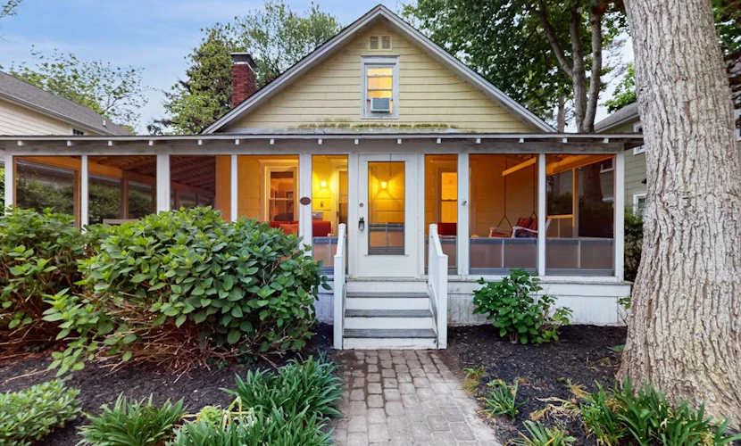 Dog-friendly 2-story home near beach with screened porch, fast WiFi, W/D, & AC