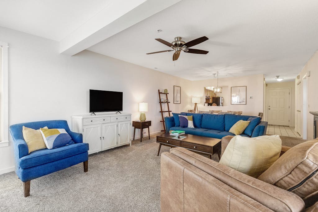 Bay view condo with screened porch, central AC, on-site golf and shared pool
