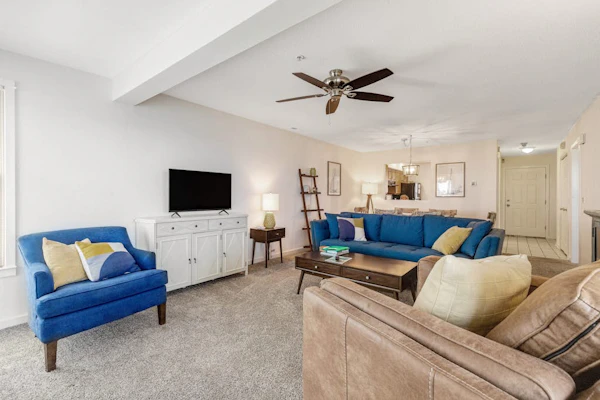 Bay view condo with screened porch, central AC, on-site golf and shared pool