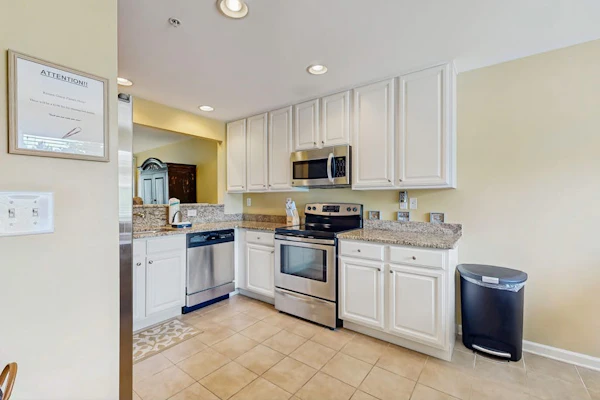Bethany Bay condo with bay views, athletic courts, pool, fireplace, & balcony