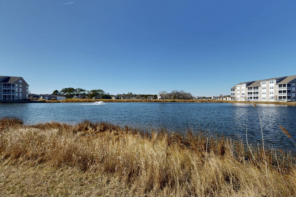 1st-floor Bethany Bay condo with bay views & on-site golf/pool/tennis