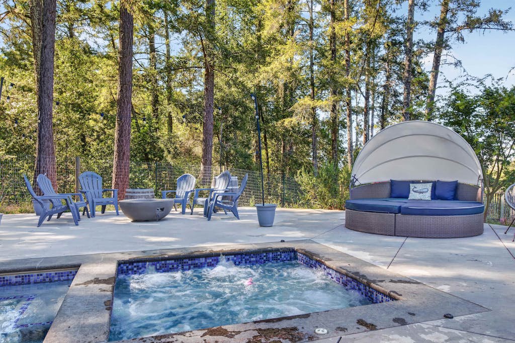 Grab pool floats and chase the pups across the fenced yard — this Sebastopol fun house is built for play-all-day families and up to four dogs. Play foosball, spin shaved ice and homemade ice cream, and serve fresh popcorn from a kitchen stocked so you never have to leave. Seat up to 16 for family dinners inside or outside while one parent slips off to a quiet desk for remote work. Sleeps 8 in four bedrooms. Heated pool and spa ringed by redwoods — Marimar Estate is 0.7 miles down the road.