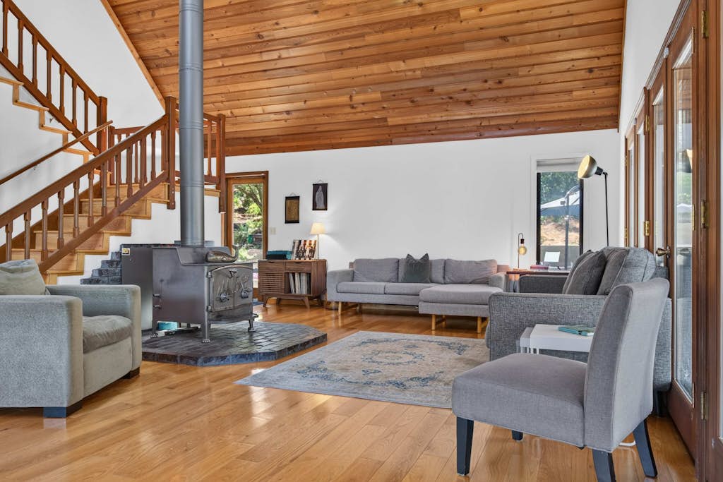 Grab pool floats and chase the pups across the fenced yard — this Sebastopol fun house is built for play-all-day families and up to four dogs. Play foosball, spin shaved ice and homemade ice cream, and serve fresh popcorn from a kitchen stocked so you never have to leave. Seat up to 16 for family dinners inside or outside while one parent slips off to a quiet desk for remote work. Sleeps 8 in four bedrooms. Heated pool and spa ringed by redwoods — Marimar Estate is 0.7 miles down the road.