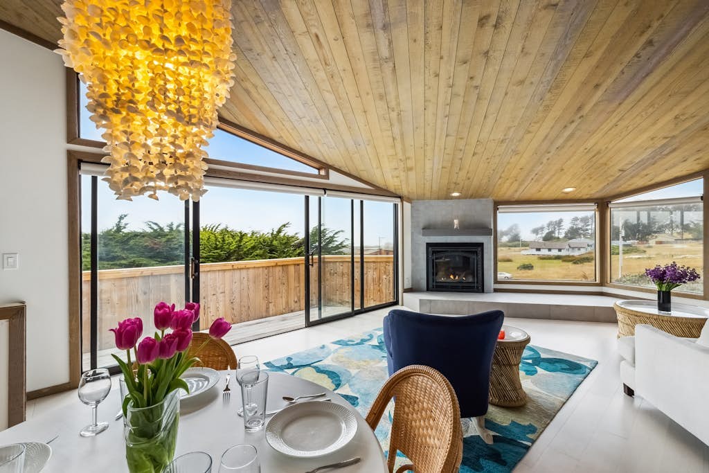 Sink into the hot tub beneath cypress trees as the sun melts into the Pacific, a few blocks inland from Portuguese Beach. This J. Carson Bowler-designed home frames coastal meadow and open ocean through walls of glass, with two king en-suite bedrooms sleeping 4. Bodega Bay's harbor and seafood shacks sit under five miles south; Jenner and the Russian River, seven miles north.