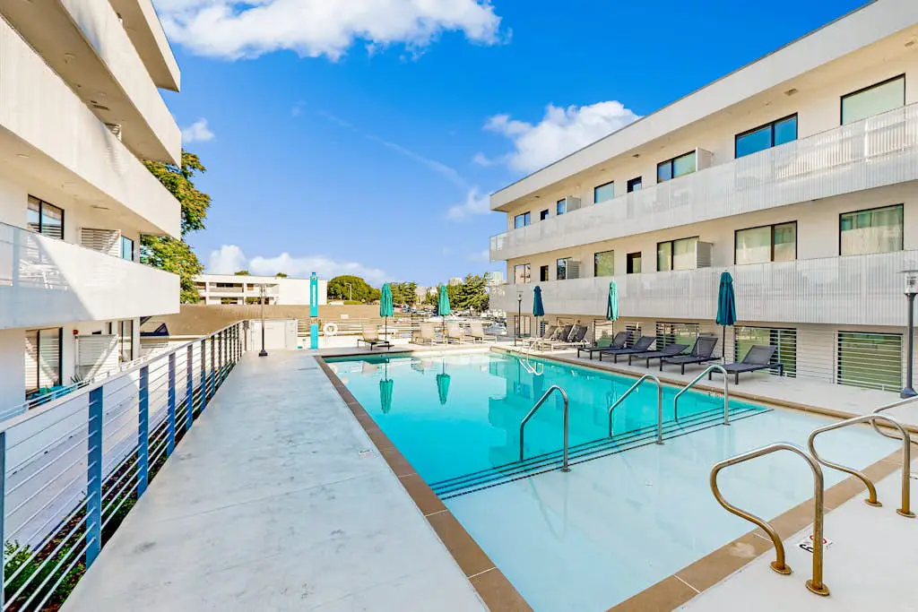 Dog-friendly treetop escape with luxe interior, seasonal pool, balcony, & WiFi