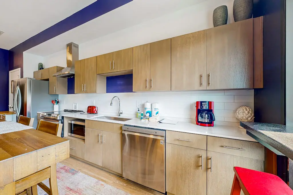 Dog-friendly treetop escape with luxe interior, seasonal pool, balcony, & WiFi