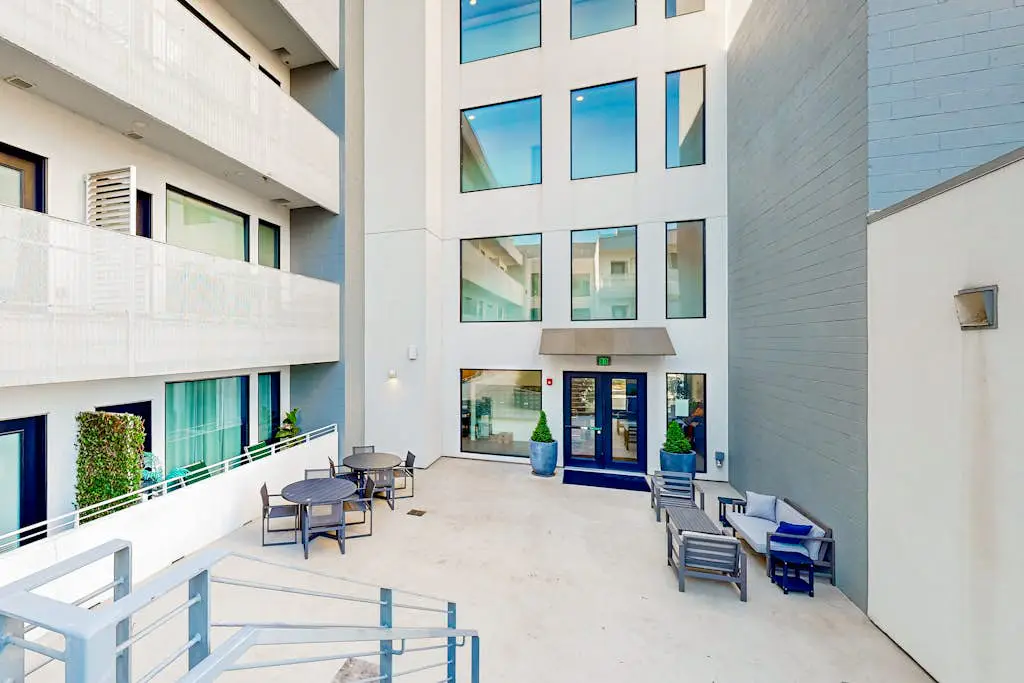 Dog-friendly treetop escape with luxe interior, seasonal pool, balcony, & WiFi
