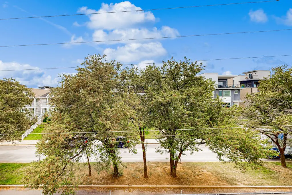 Dog-friendly treetop escape with luxe interior, seasonal pool, balcony, & WiFi