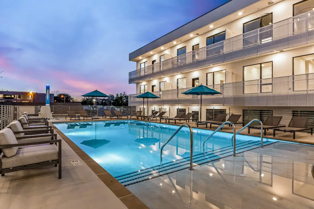 Dog-friendly treetop escape with luxe interior, seasonal pool, balcony, & WiFi