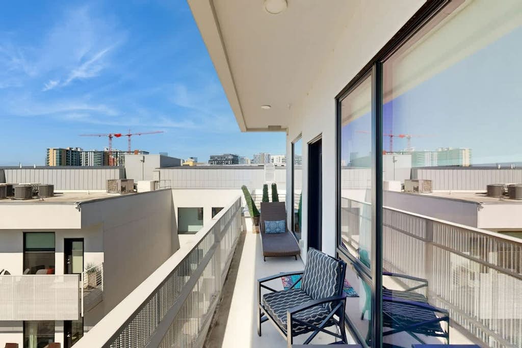 Luxe Top Floor Condo with Balcony, W/D, Seasonal Courtyard Pool, & Gym