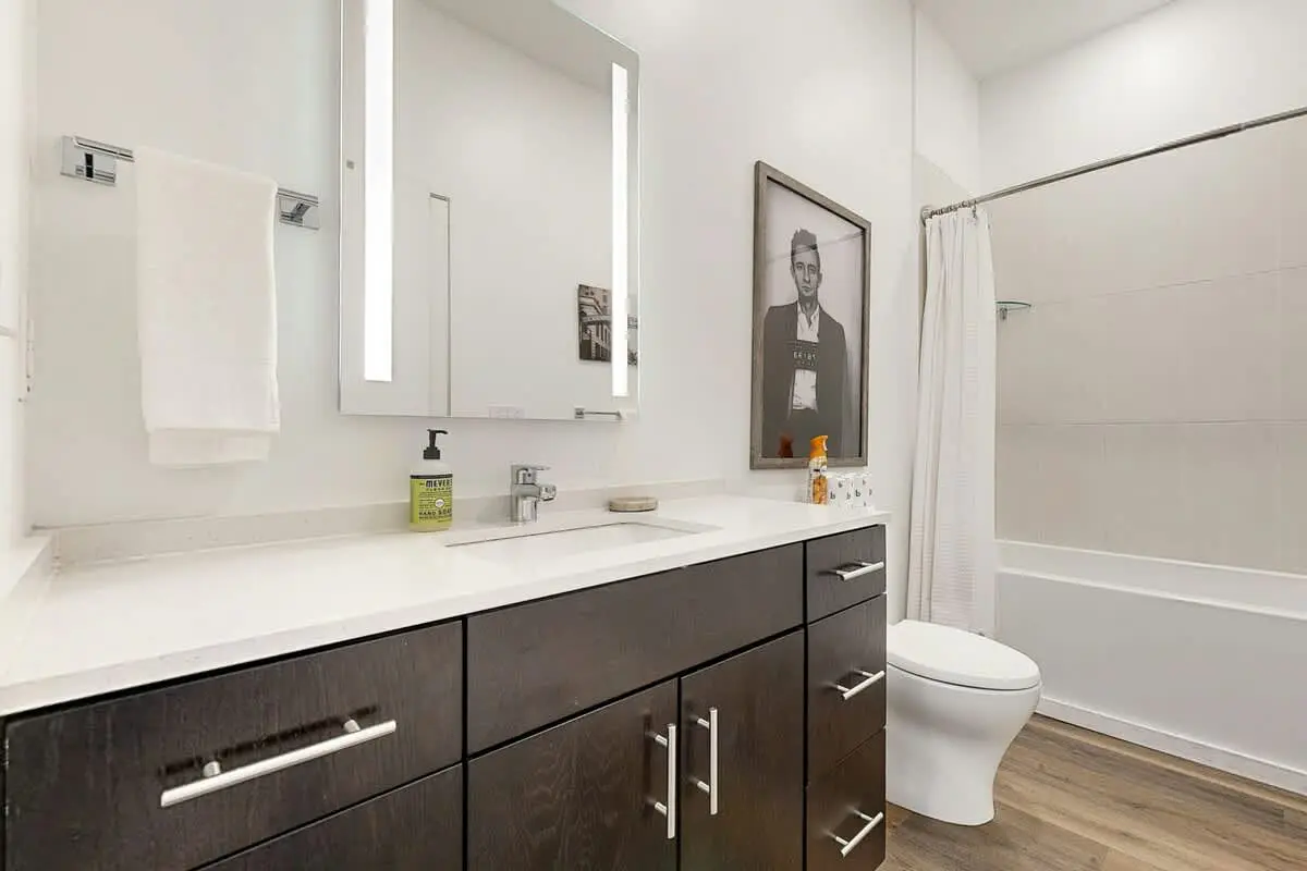 Luxe Top Floor Condo with Balcony, W/D, Seasonal Courtyard Pool, & Gym