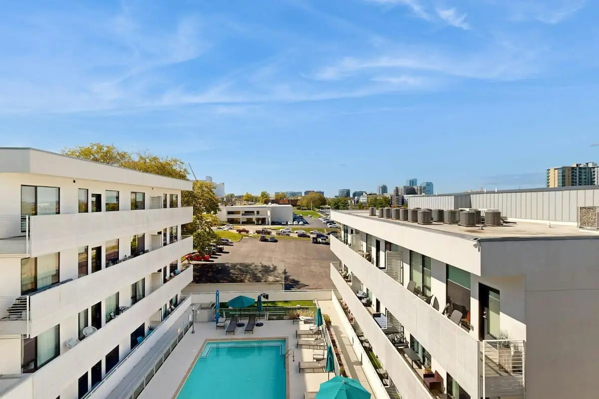 Luxe Top Floor Condo with Balcony, W/D, Seasonal Courtyard Pool, & Gym