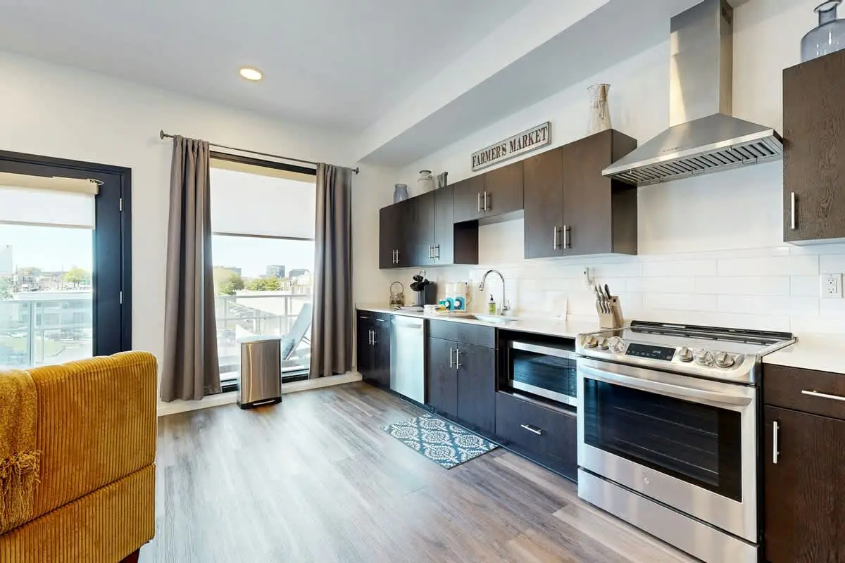 Luxe Top Floor Condo with Balcony, W/D, Seasonal Courtyard Pool, & Gym