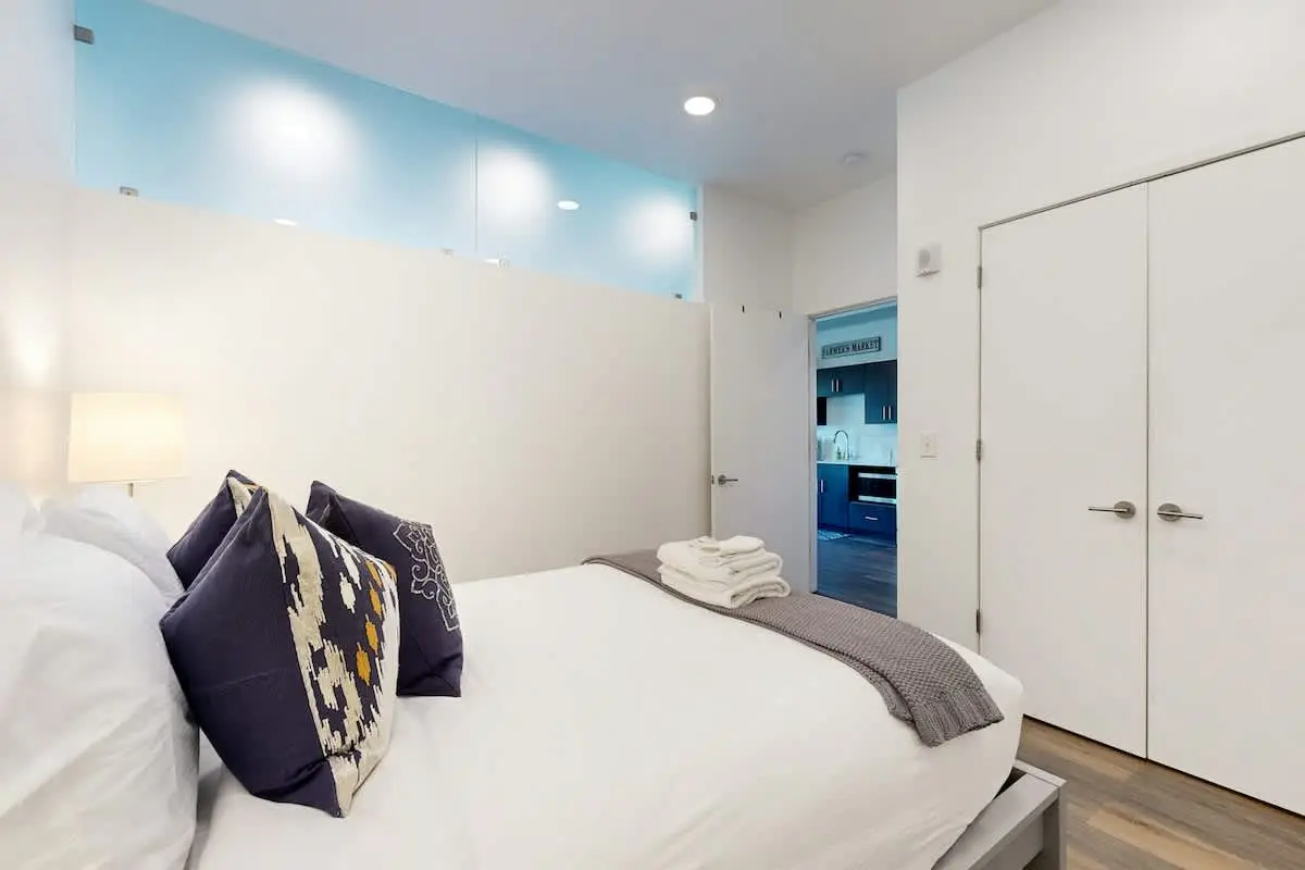 Luxe Top Floor Condo with Balcony, W/D, Seasonal Courtyard Pool, & Gym