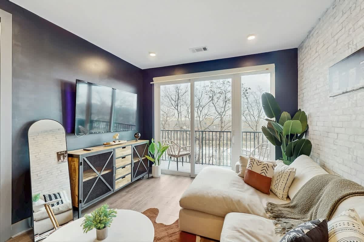 Modern Muse downtown condo with private balcony, central AC, & rooftop lounge