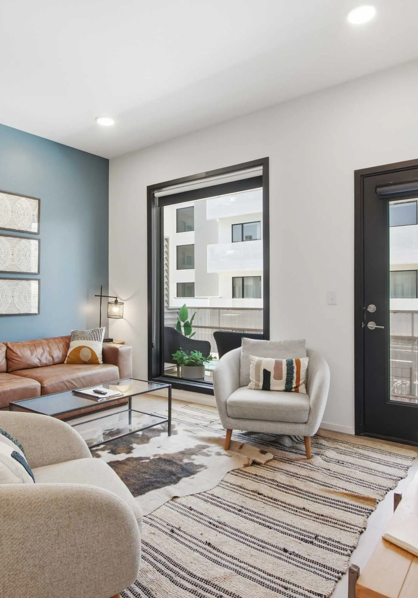 Modern condo near attractions with outdoor pool, balcony, central AC, and WiFi