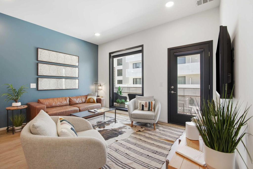 Modern condo near attractions with outdoor pool, balcony, central AC, and WiFi