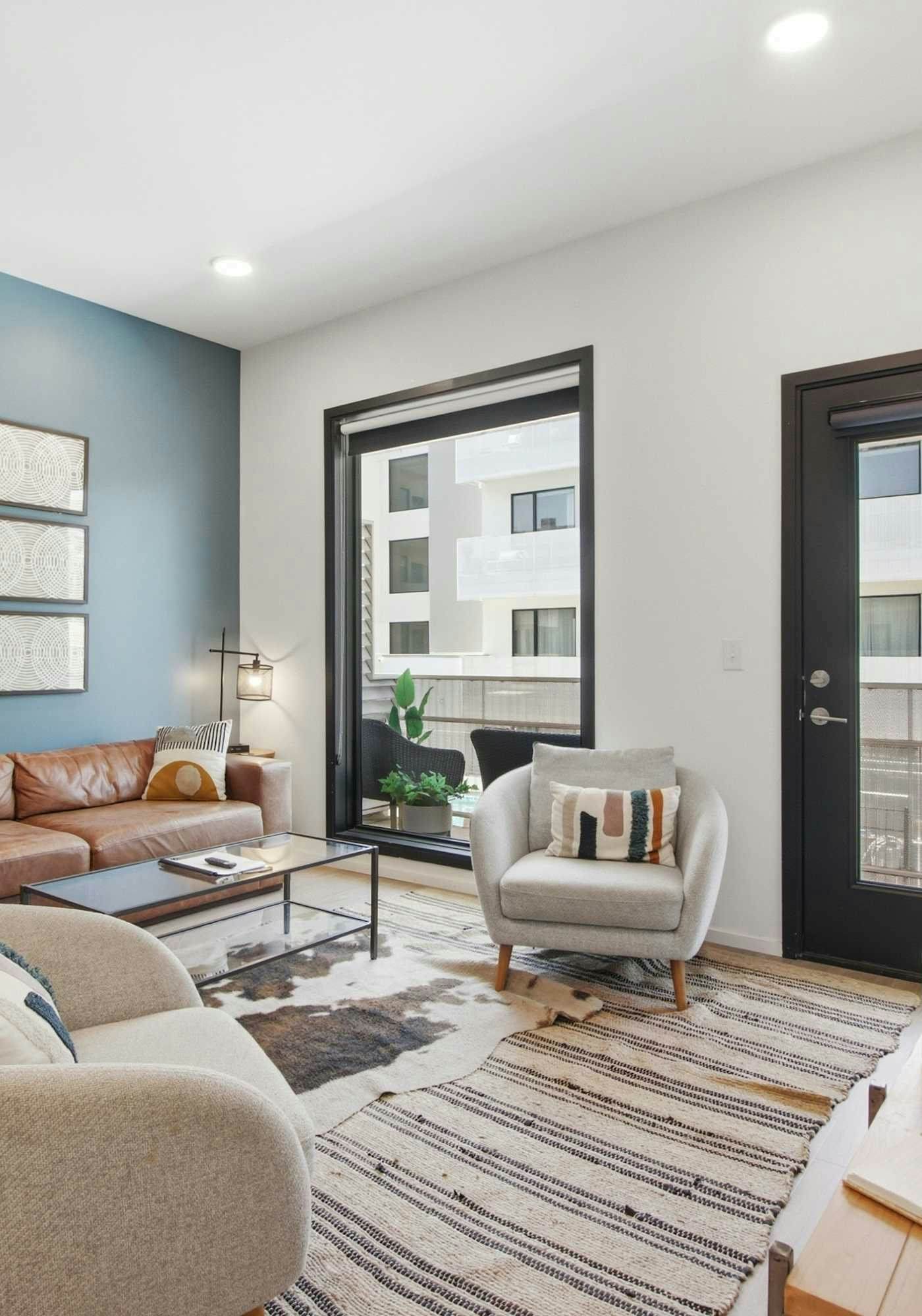 Modern condo near attractions with outdoor pool, balcony, central AC, and WiFi