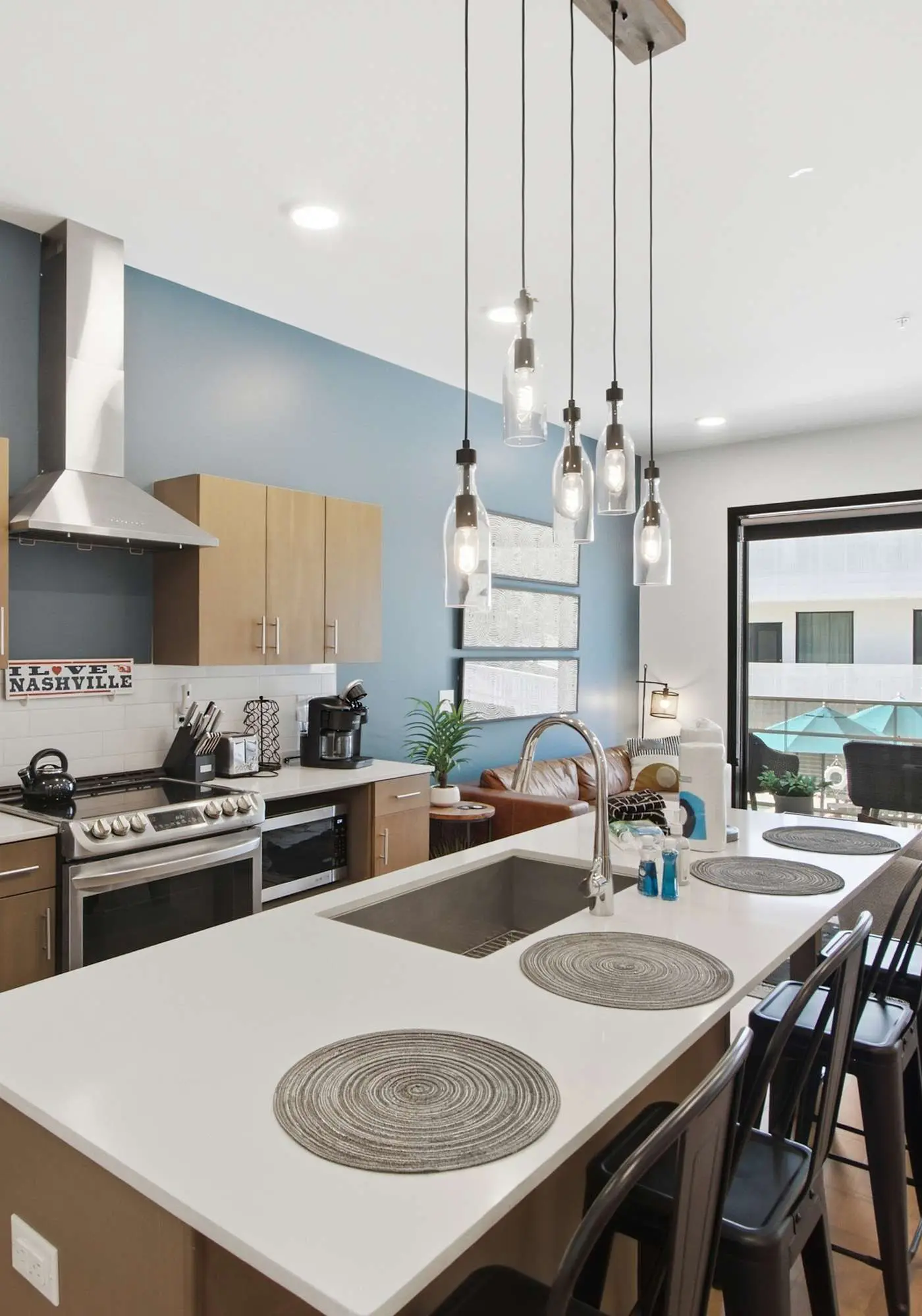 Modern condo near attractions with outdoor pool, balcony, central AC, and WiFi