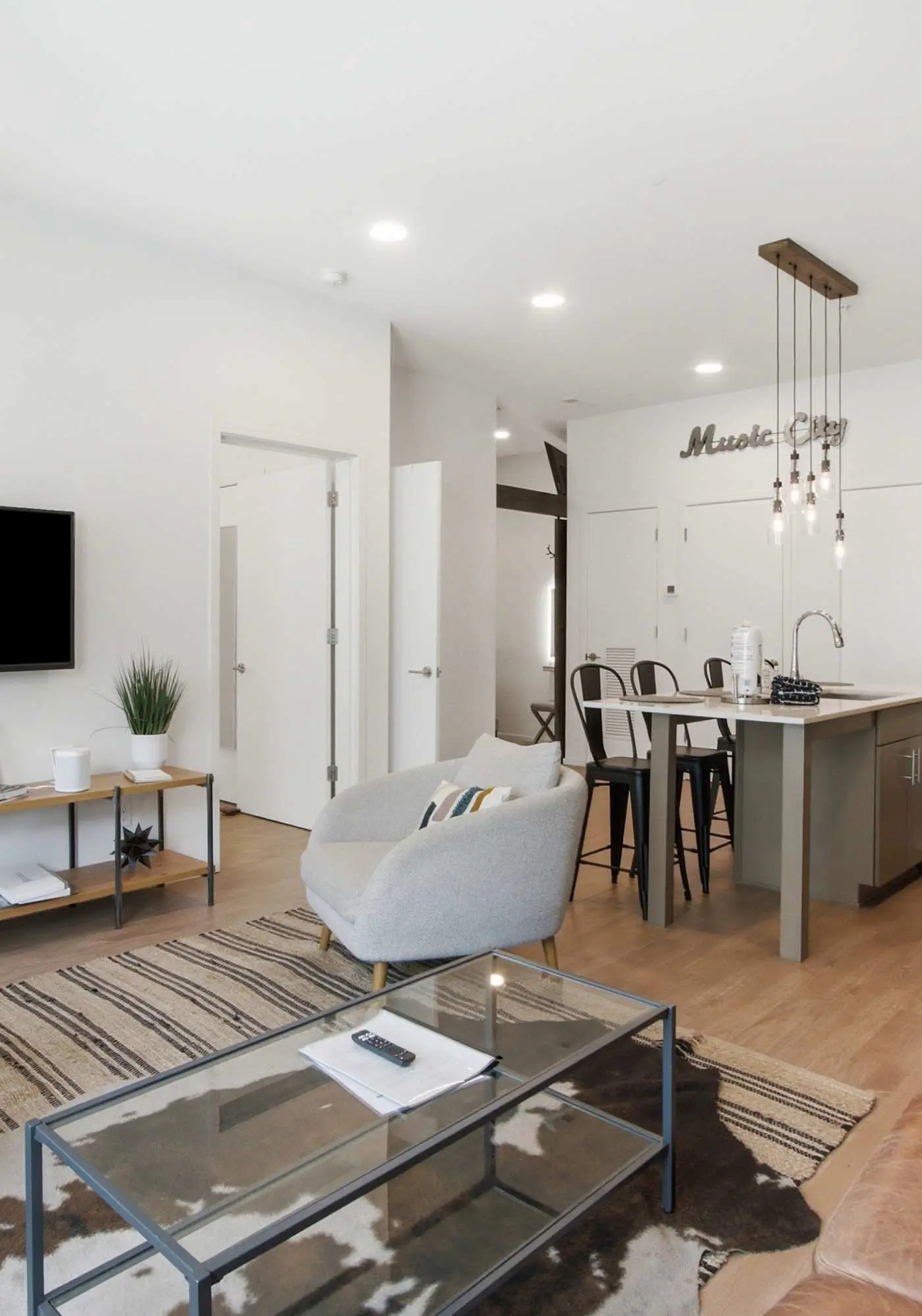 Modern condo near attractions with outdoor pool, balcony, central AC, and WiFi