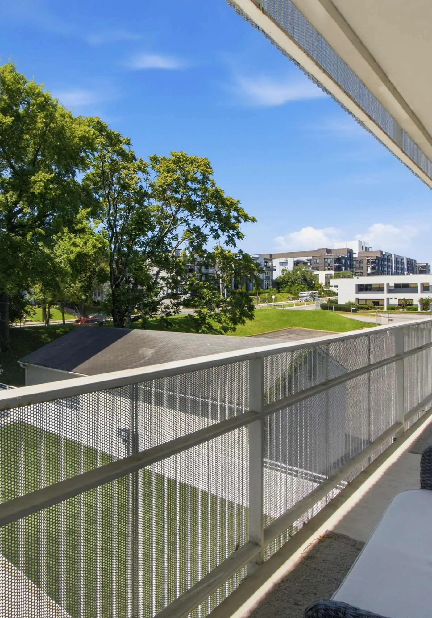 Modern condo near attractions with outdoor pool, balcony, central AC, and WiFi