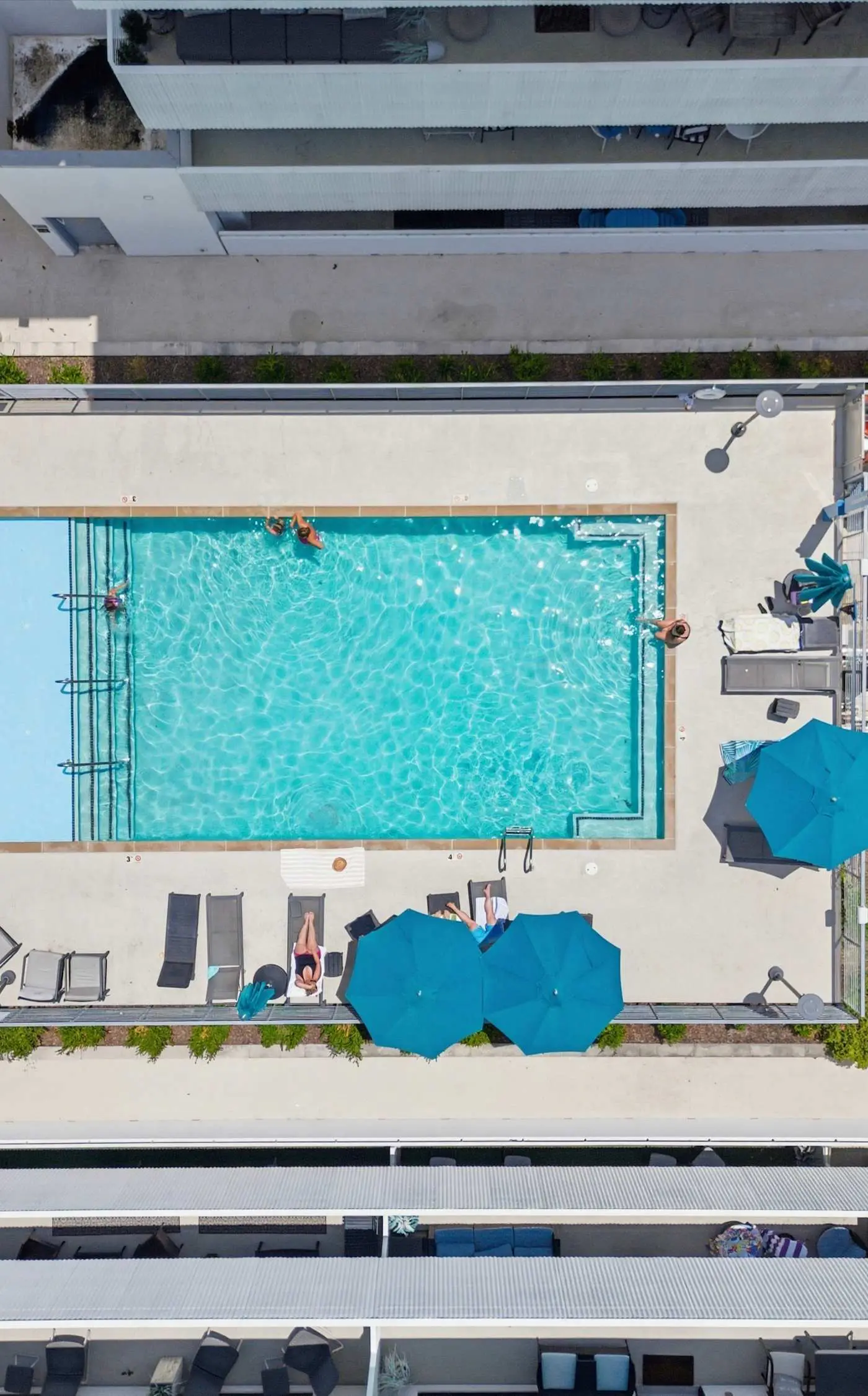 Modern condo near attractions with outdoor pool, balcony, central AC, and WiFi