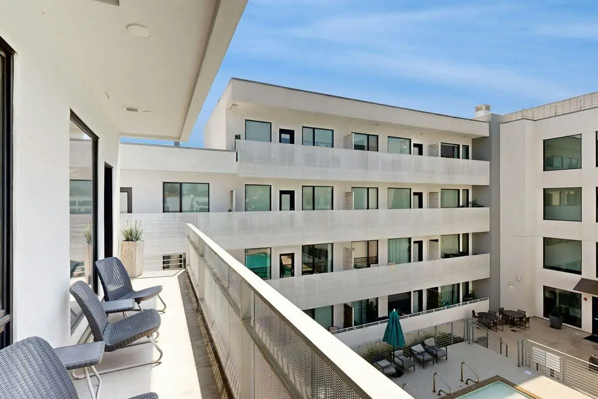 Chic Corner Condo with Balcony, Central AC, W/D, Seasonal Pool, & Gym