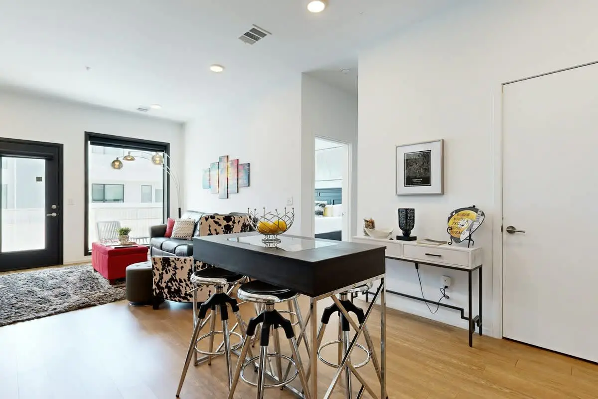 Chic Corner Condo with Balcony, Central AC, W/D, Seasonal Pool, & Gym