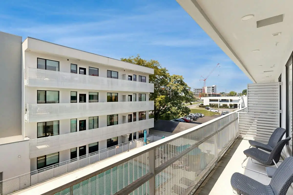 Chic Corner Condo with Balcony, Central AC, W/D, Seasonal Pool, & Gym
