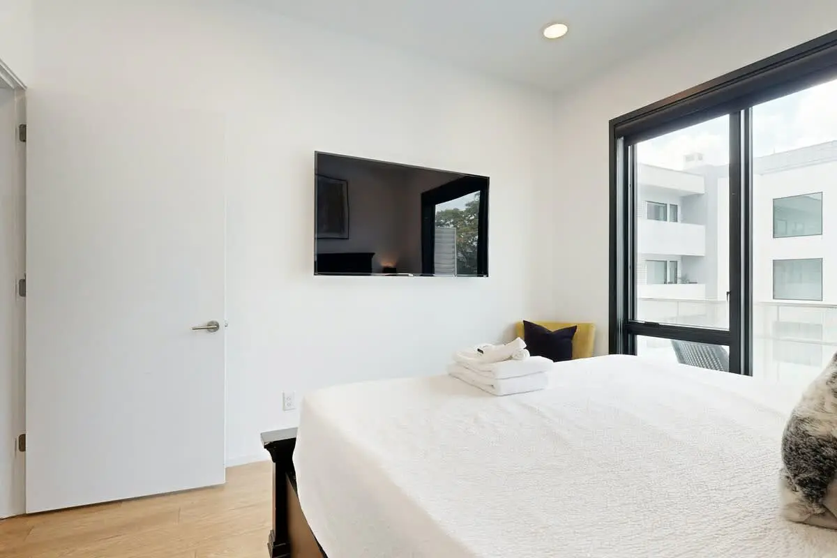 Chic Corner Condo with Balcony, Central AC, W/D, Seasonal Pool, & Gym