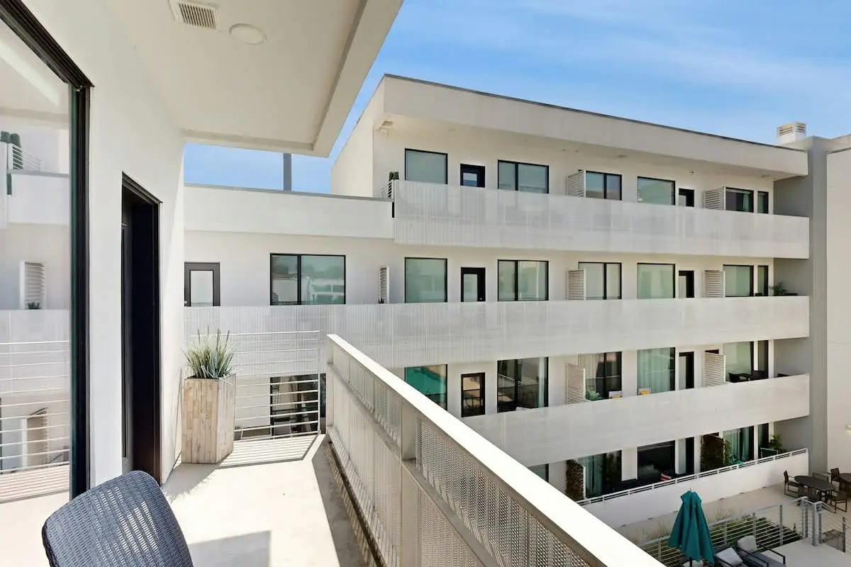 Chic Corner Condo with Balcony, Central AC, W/D, Seasonal Pool, & Gym