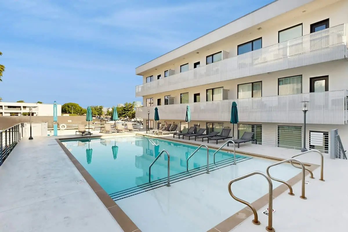 Chic Corner Condo with Balcony, Central AC, W/D, Seasonal Pool, & Gym
