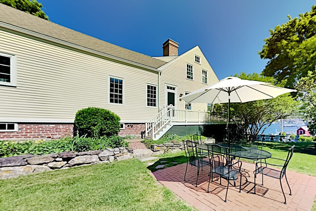 All-suite Boothbay Harbor home with deck, ocean views, and fireplaces