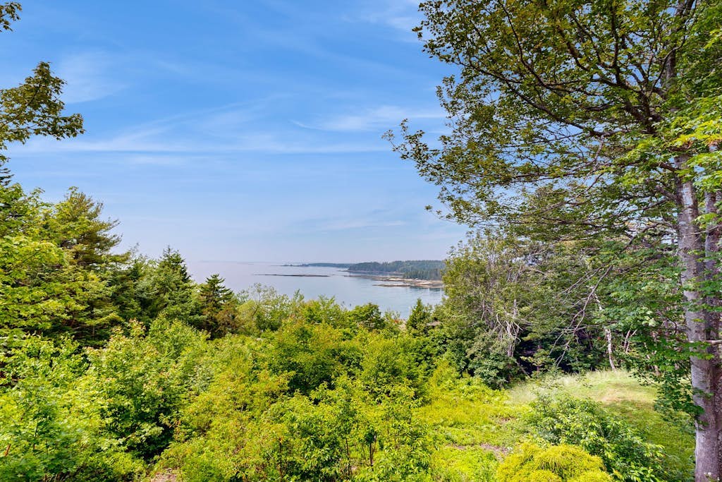 Water view home with scenic balcony, grill, board games, and AC