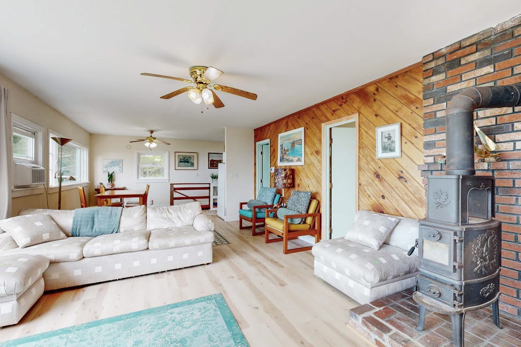 Water view home with scenic balcony, grill, board games, and AC