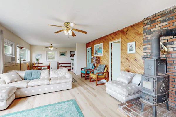 Water view home with scenic balcony, grill, board games, and AC