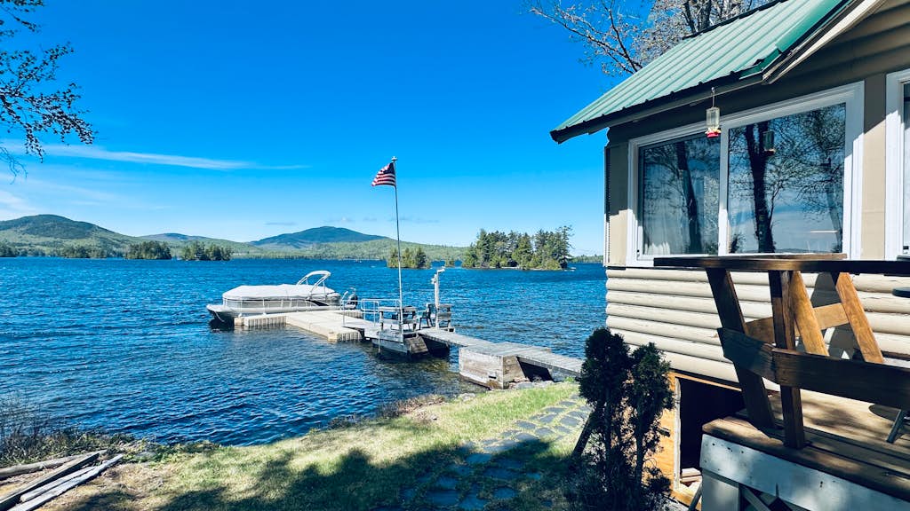 Vintage lakefront cabin with incredible water views, private dock & pebble beach