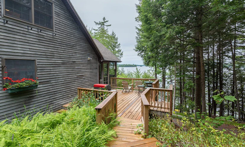 Gorgeous lakefront home w/ dock, canoe, kayaks & lake/forest views
