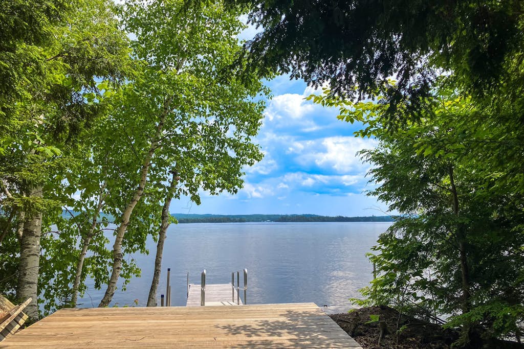 Spectacular lakefront home with dock, firepit, & vaulted ceilings - dog-friendly