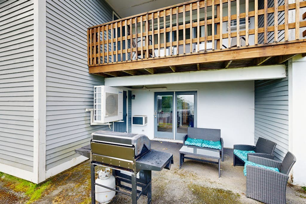 Newly-furnished condo with loft, fast WiFi, partial AC, grills & yard access