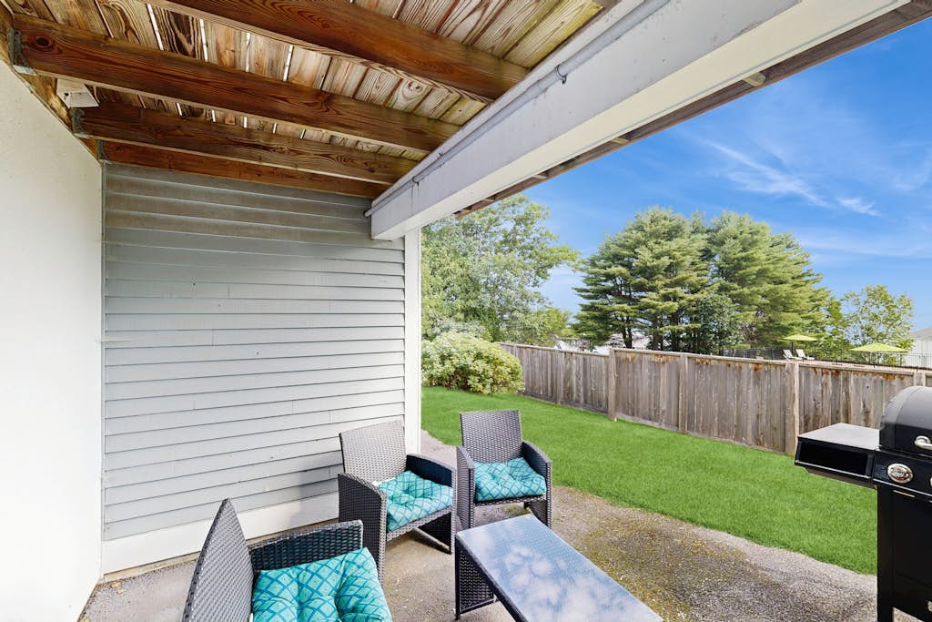 Newly-furnished condo with loft, fast WiFi, partial AC, grills & yard access